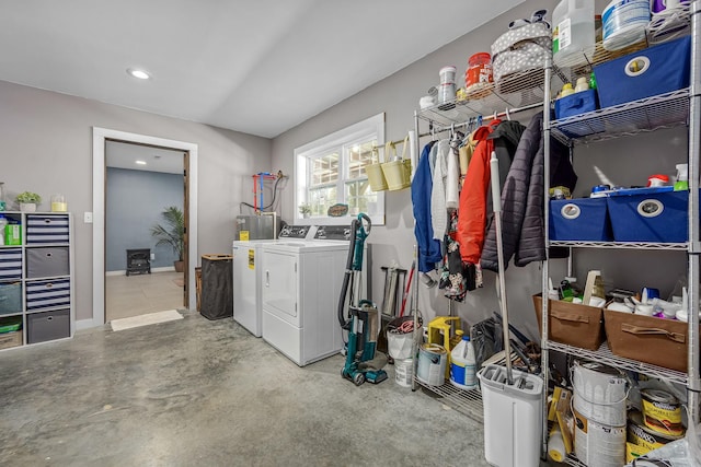 laundry room featuring baseboards, separate washer and dryer, and laundry area