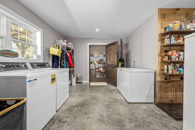 washroom with laundry area and independent washer and dryer