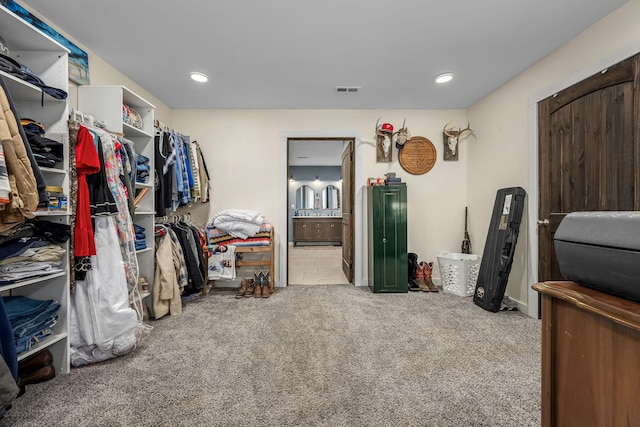 walk in closet featuring carpet and visible vents