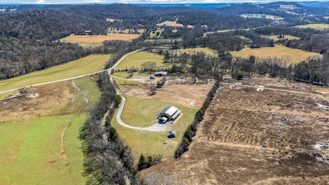 bird's eye view featuring a rural view and a view of trees