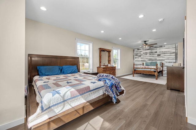 bedroom with recessed lighting, baseboards, wood finished floors, and a ceiling fan