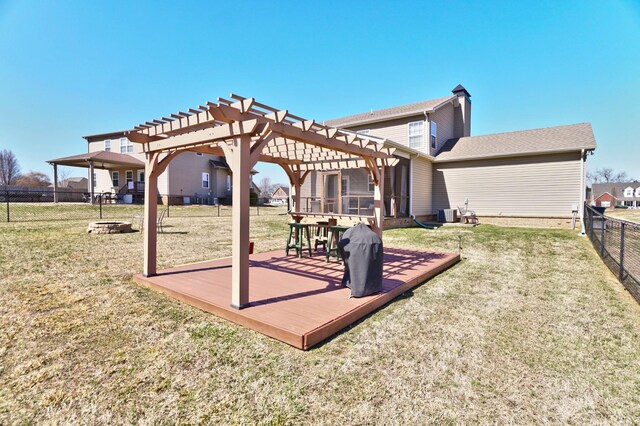 exterior space featuring a wooden deck, a pergola, and fence