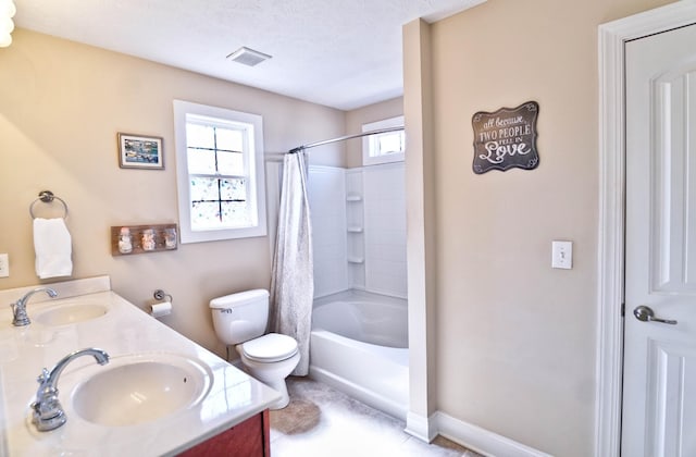 full bath featuring a sink, visible vents, toilet, and double vanity