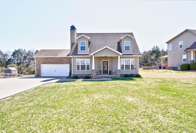 view of front of home with roof with shingles, a front lawn, concrete driveway, a garage, and brick siding