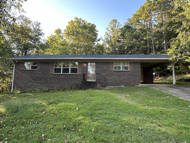 single story home with an attached carport, brick siding, a front lawn, and driveway