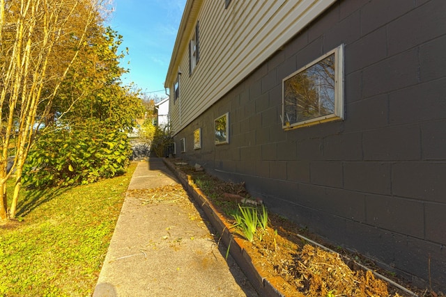 view of home's exterior with concrete block siding