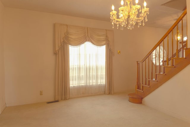 unfurnished living room with visible vents, baseboards, stairs, and carpet