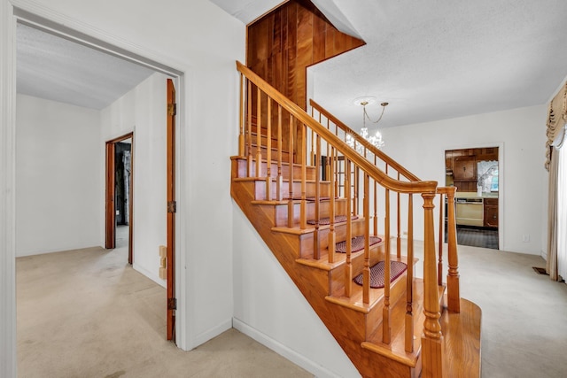 253 Main St, Ducktown, TN 37326 - stairs featuring carpet floors and a chandelier