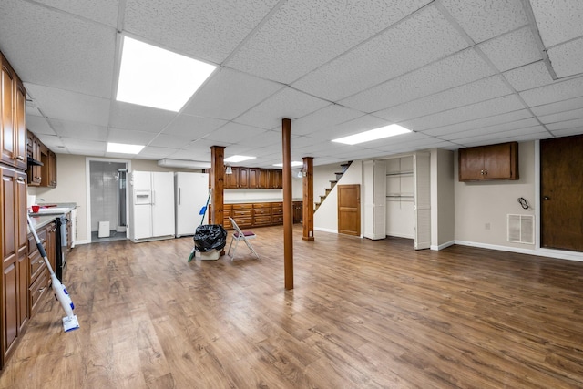 253 Main St, Ducktown, TN 37326 - finished below grade area with stairs, wood finished floors, baseboards, and a paneled ceiling