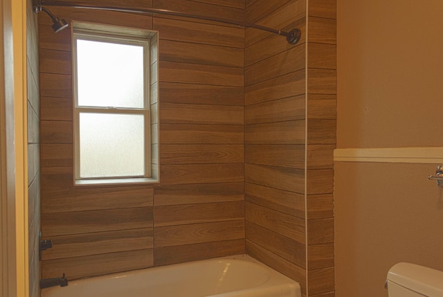 full bathroom featuring toilet and washtub / shower combination