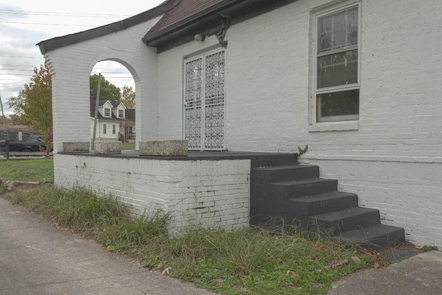 view of home's exterior with brick siding