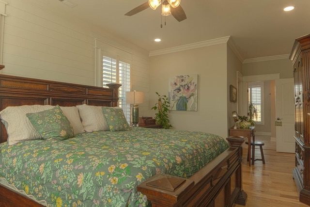 bedroom with light wood-type flooring, recessed lighting, crown molding, baseboards, and ceiling fan