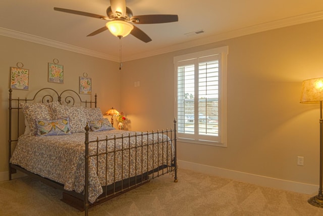 carpeted bedroom featuring baseboards, multiple windows, and crown molding