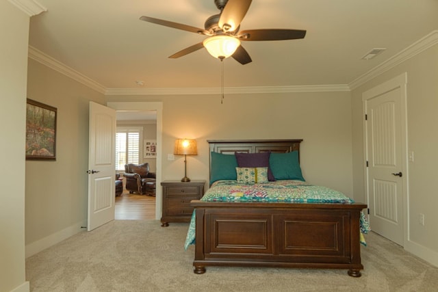 bedroom with light colored carpet and crown molding