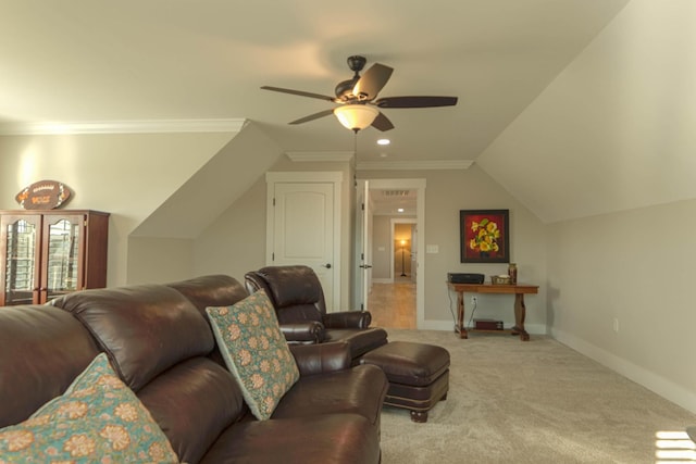 living room with a ceiling fan, baseboards, vaulted ceiling, crown molding, and light colored carpet