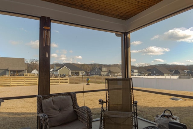 view of patio with a residential view, an enclosed area, and fence