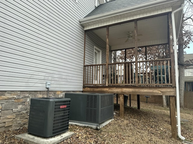 exterior space featuring central air condition unit and ceiling fan