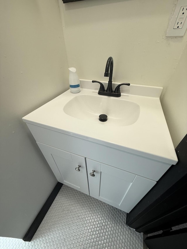 bathroom with tile patterned floors and vanity