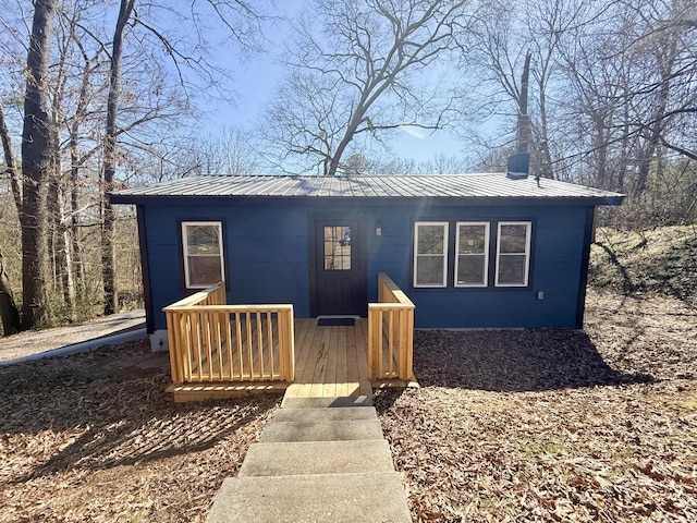 bungalow featuring metal roof