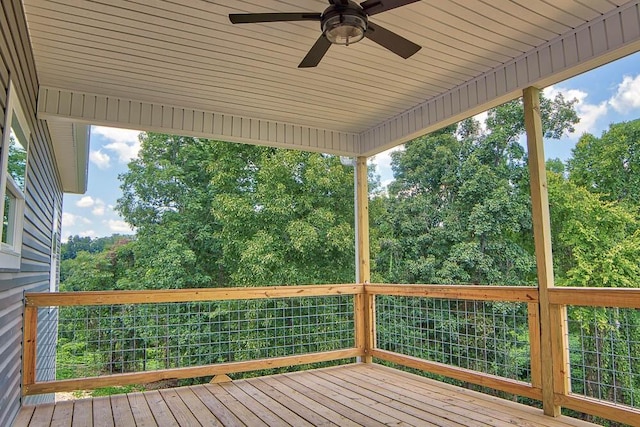 wooden deck featuring ceiling fan