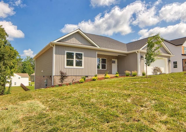 view of front of property with crawl space, an attached garage, and a front lawn