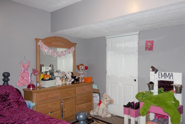 bedroom featuring a textured ceiling