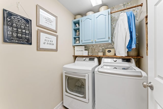 laundry room featuring cabinet space and washing machine and clothes dryer