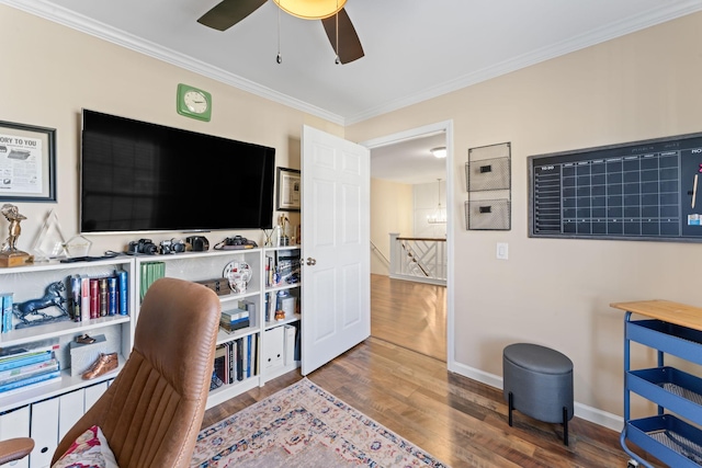 office with ornamental molding, baseboards, a ceiling fan, and wood finished floors