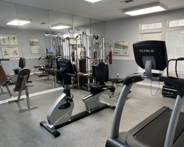 workout area with visible vents and baseboards