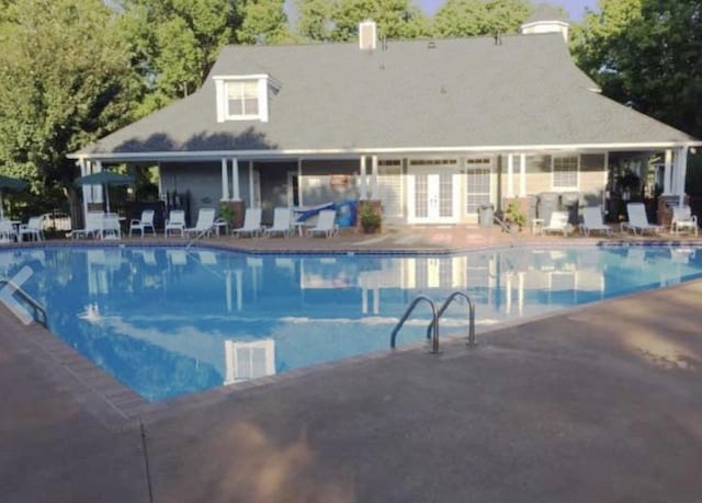 community pool featuring a patio area and french doors