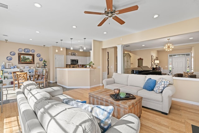 living room featuring visible vents, a ceiling fan, recessed lighting, light wood finished floors, and decorative columns