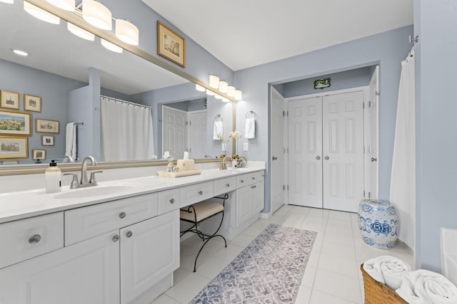 full bathroom with tile patterned floors and vanity