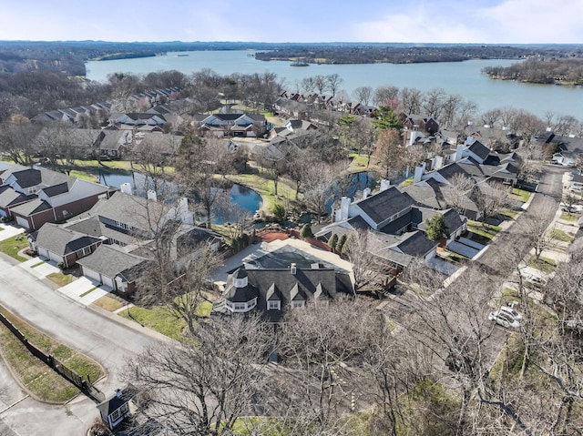 bird's eye view with a residential view and a water view