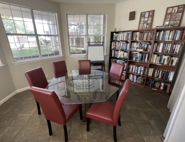 dining space with tile patterned floors and baseboards