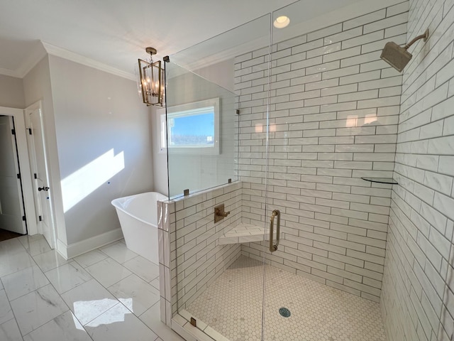 bathroom with a freestanding tub, marble finish floor, a stall shower, crown molding, and baseboards