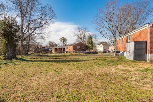 view of yard with fence and a residential view