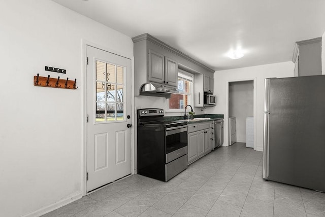 kitchen featuring gray cabinets, appliances with stainless steel finishes, and a sink