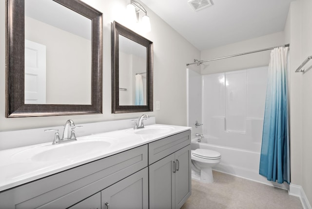 bathroom featuring double vanity, visible vents, shower / bath combo, and a sink