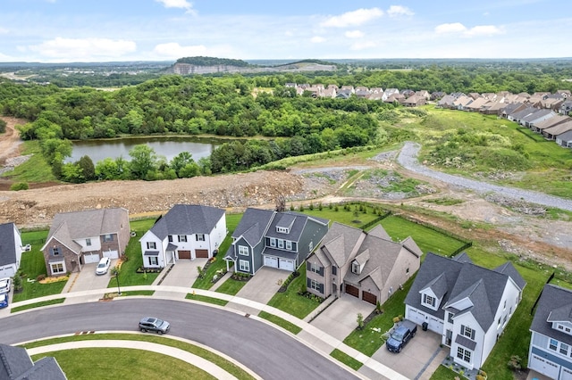 drone / aerial view featuring a residential view and a water view