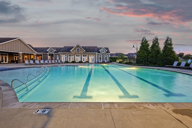 pool featuring a patio area and fence