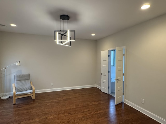 unfurnished room featuring recessed lighting, baseboards, and dark wood-type flooring