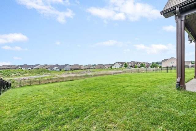 view of yard featuring a residential view and a fenced backyard