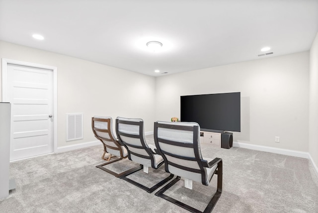 interior space featuring visible vents, baseboards, and carpet flooring