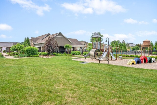 community jungle gym featuring a yard