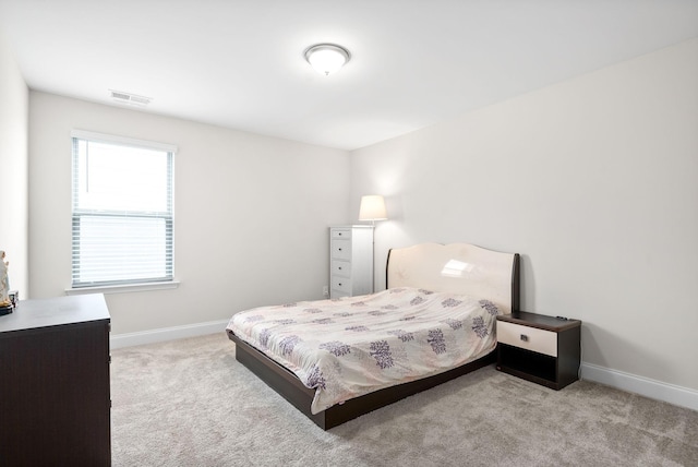 bedroom featuring visible vents, baseboards, and carpet flooring