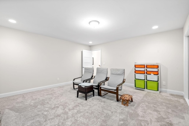 sitting room with recessed lighting, baseboards, and carpet flooring