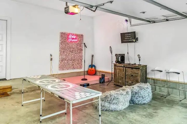 playroom with a garage and concrete flooring