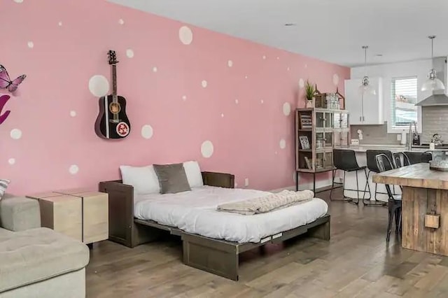 bedroom featuring wood finished floors