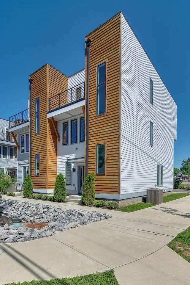 exterior space featuring central AC and a balcony