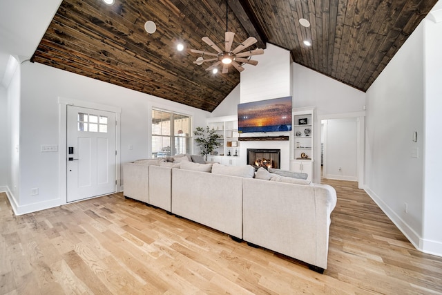 living area with light wood-type flooring, high vaulted ceiling, and wood ceiling